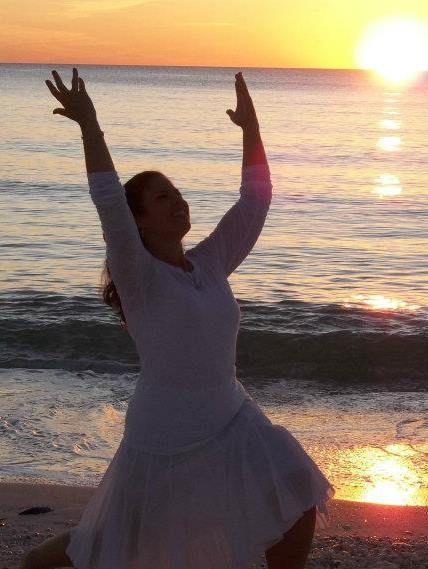 Fort Myers Beach Yoga Instructor Beck Lang Headshot yoga pose by sunset on the beach